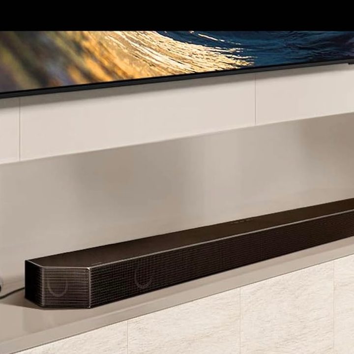 The Samsung HW-Q800D Dolby Atmos Soundbar hooked up to a wall-mounted TV.