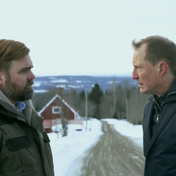 Mattias Nordkvist and Peter Eggers speak on a rural road in The Breakthrough.