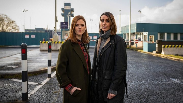 Two women stand on a dick in Vigil.