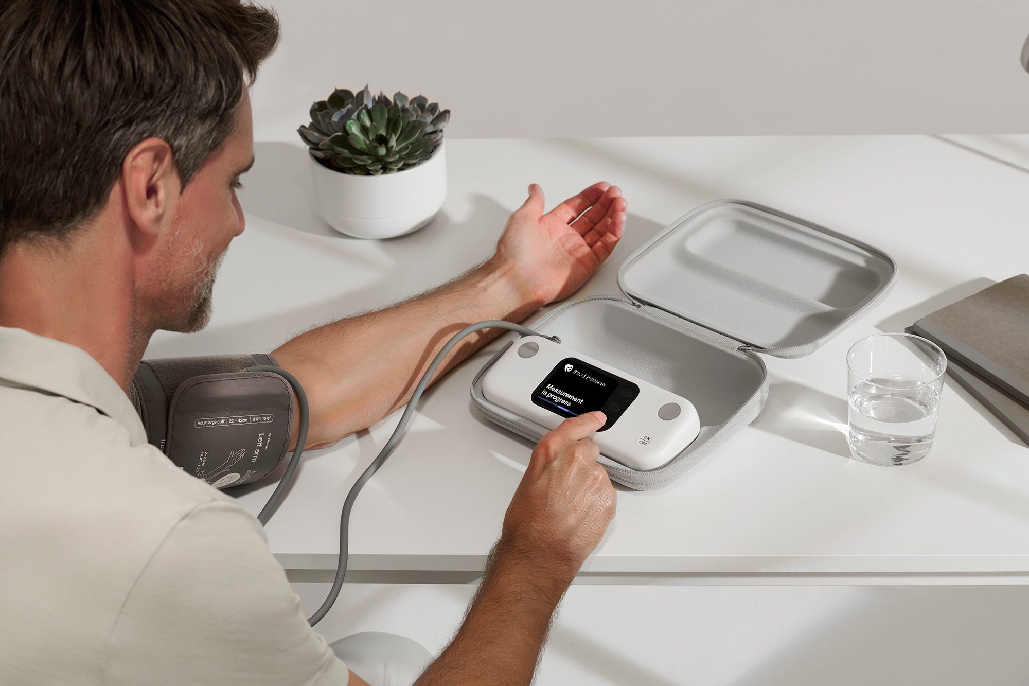 A person using the Withings BPM VIsion.