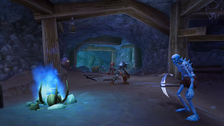 Skeletons wander around a mine in World of Warcraft.