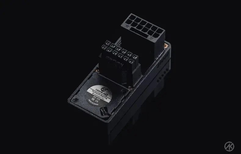 A 12VHPWR angled adapter by a Chinese manufacturer featuring a cooling fan and LCD