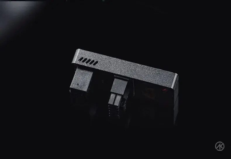 A 12VHPWR angled adapter by a Chinese manufacturer featuring a cooling fan and LCD