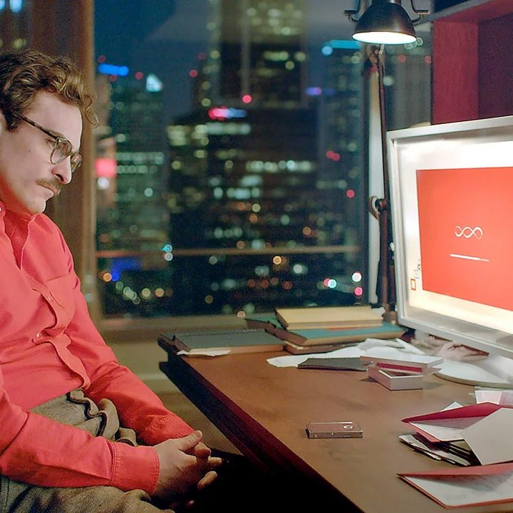 Her movie picture man looking at a computer screen