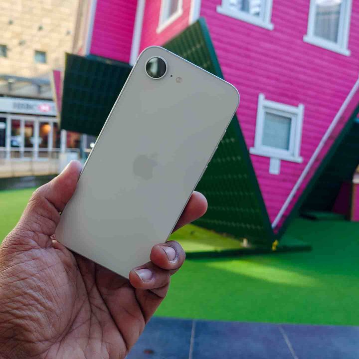 The back of the iPhone 16e in a hand
