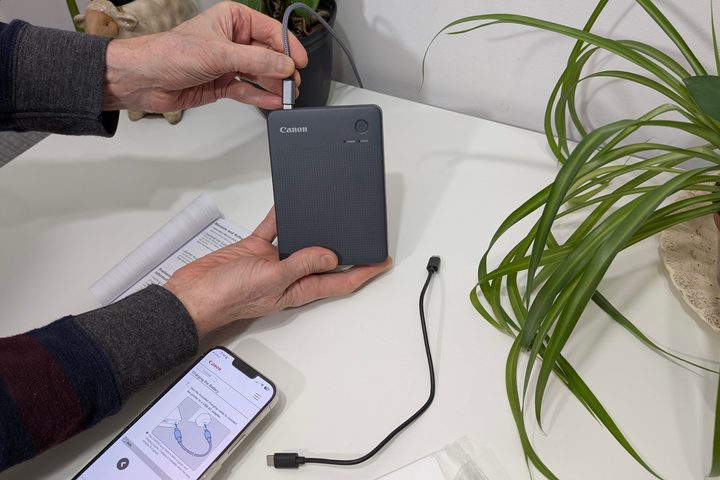 Canon bundles a short USB cable with the Selphy QX20, but it works with a standard USB-C cable and charger.