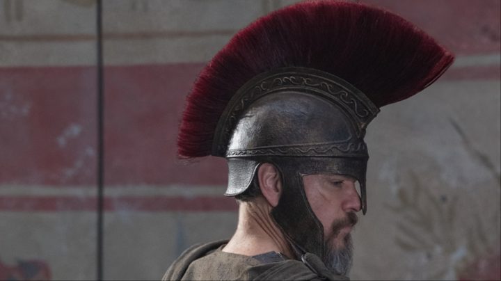 Matt Damon stares with a helmet on.