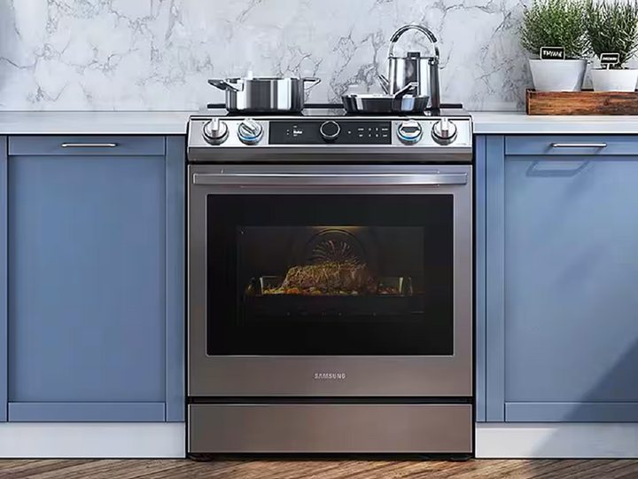The Samsung - 6.3 cu. ft. Slide-in Induction Range in the kitchen.