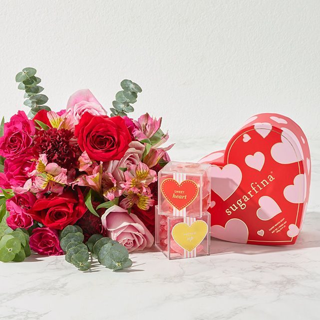 bouquet of flowers and heart-shaped candy box