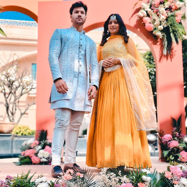 Portrait of an Indian bride and groom at their wedding ceremony shot on Vivo V50 with Zeiss effects and Aura Light.