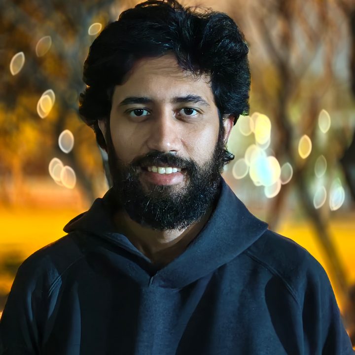Portrait of a man standing in a park at night shot on Vivo V50 with Zeiss effects and Aura Light.
