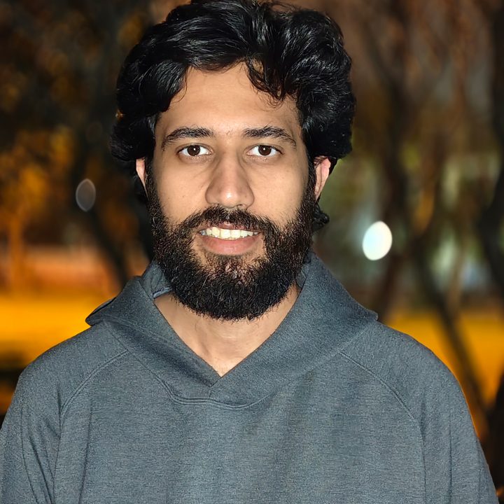 Portrait of a man standing in a park at night shot on Vivo V50 with Zeiss effects and Aura Light.