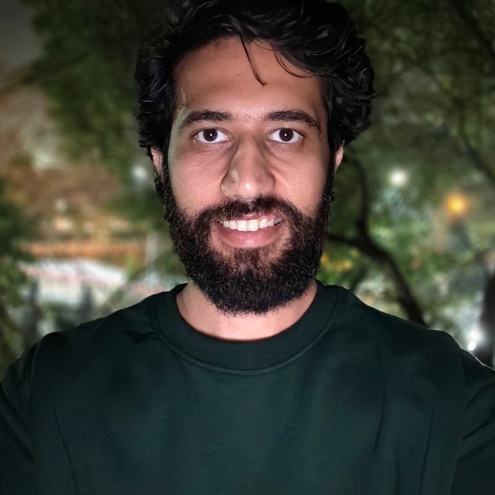 Low light selfie portrait of a man shot on Vivo V50.
