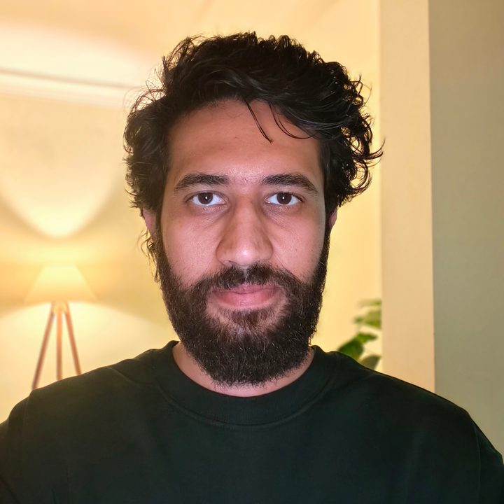 Low light selfie portrait of a man shot on Vivo V50.