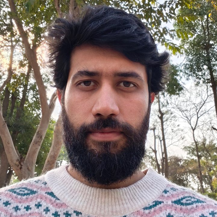 Daylight selfie of a man shot with Vivo V50.