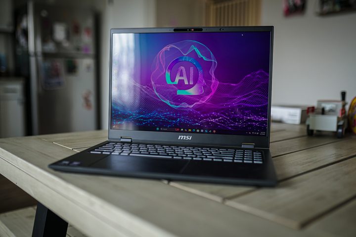 An MSI laptop sitting on a table.