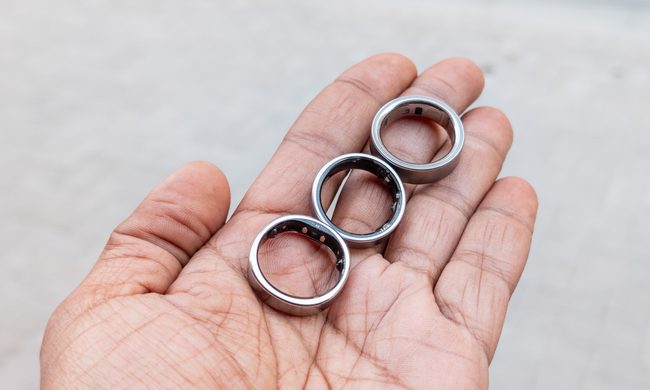 Oura Ring 4, Galaxy Ring and RingConn Gen 2 in the palm of a hand