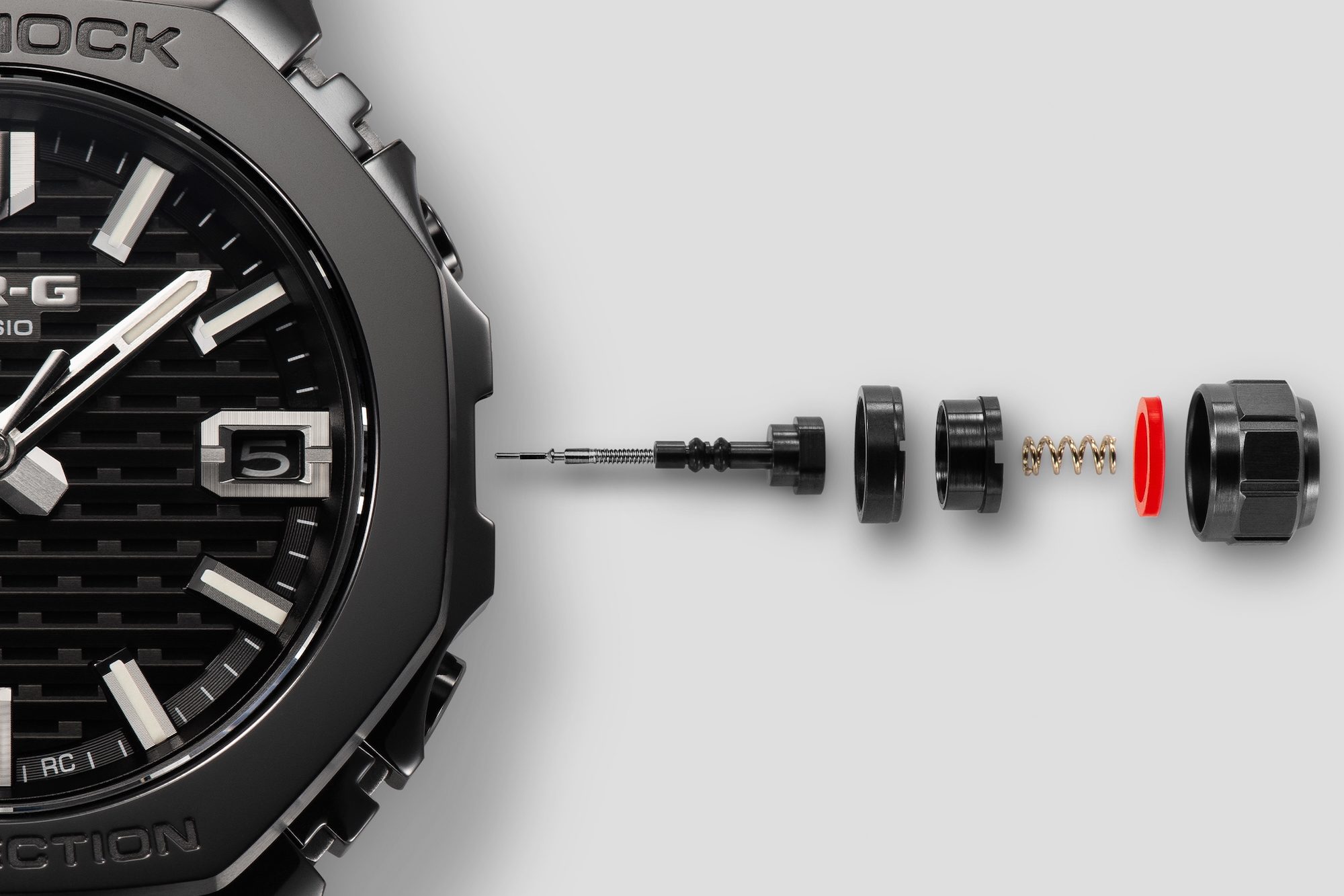 The crown on the Casio G-Shock MRG-B2100R-2A watch.