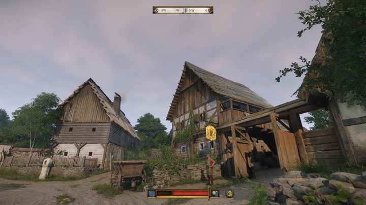 The player looks at a tavern in a village.