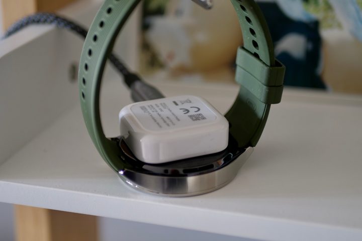 The OnePlus Watch 3 on charge.