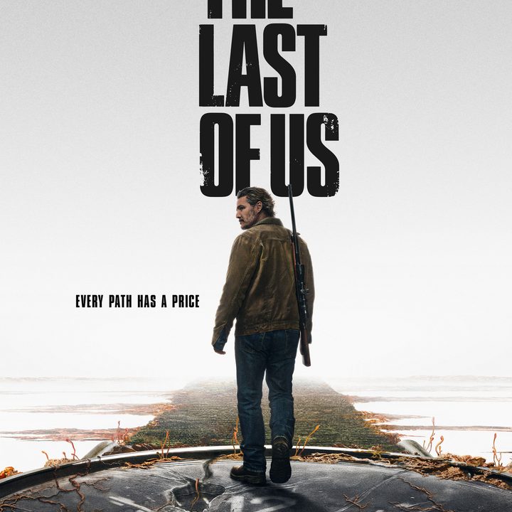 Joel walks with a gun in The Last of Us.