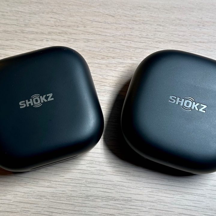 Shokz OpenFit and OpenFit 2 charging cases.