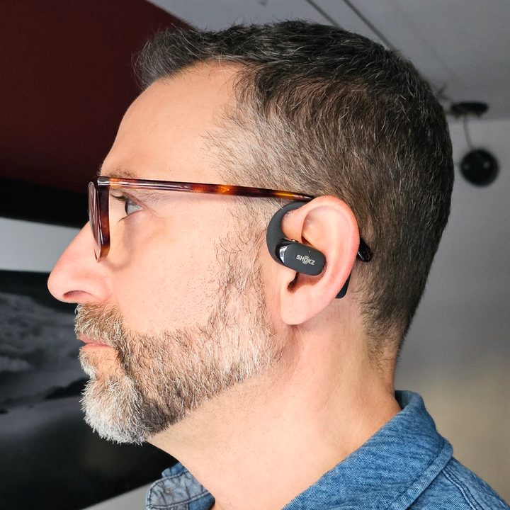 Simon Cohen wearing Shokz OpenFit 2 (side view).