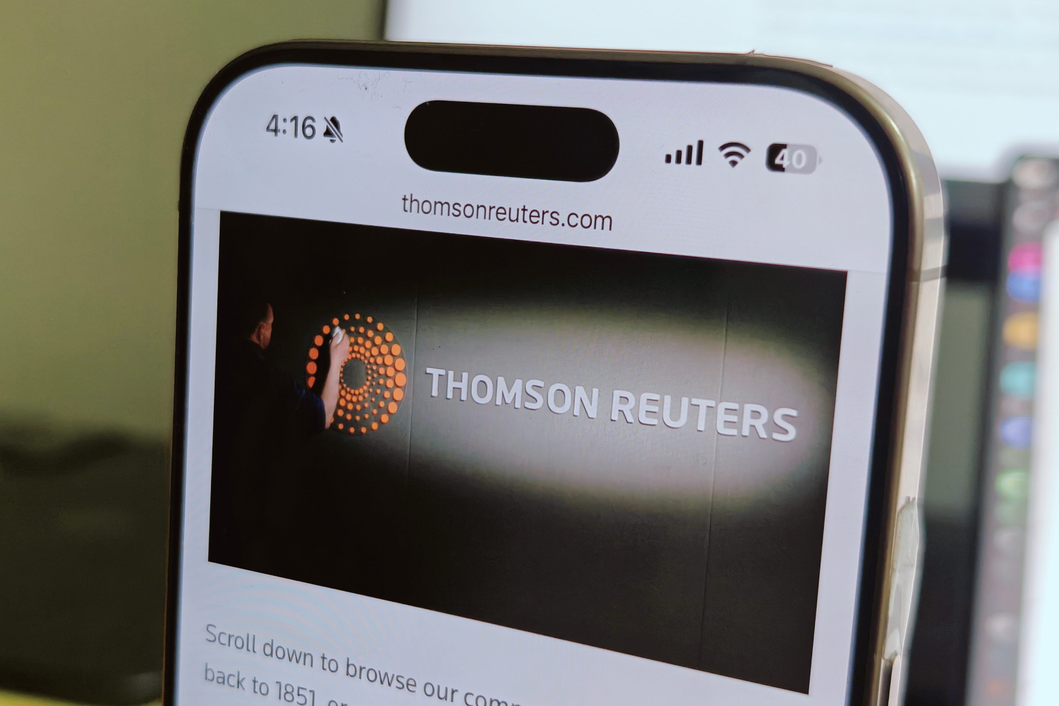 Thomson Reuters website as seen on an iPhone 16 Pro.