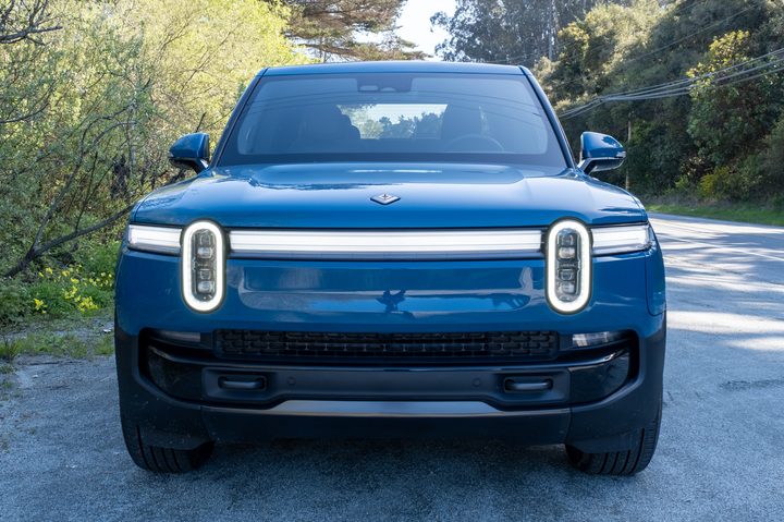 The front of a blue 2025 Rivian R1T truck