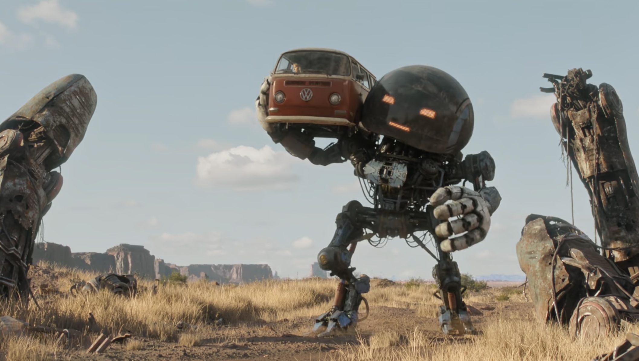 A giant Herm carrying a van in "The Electric State."