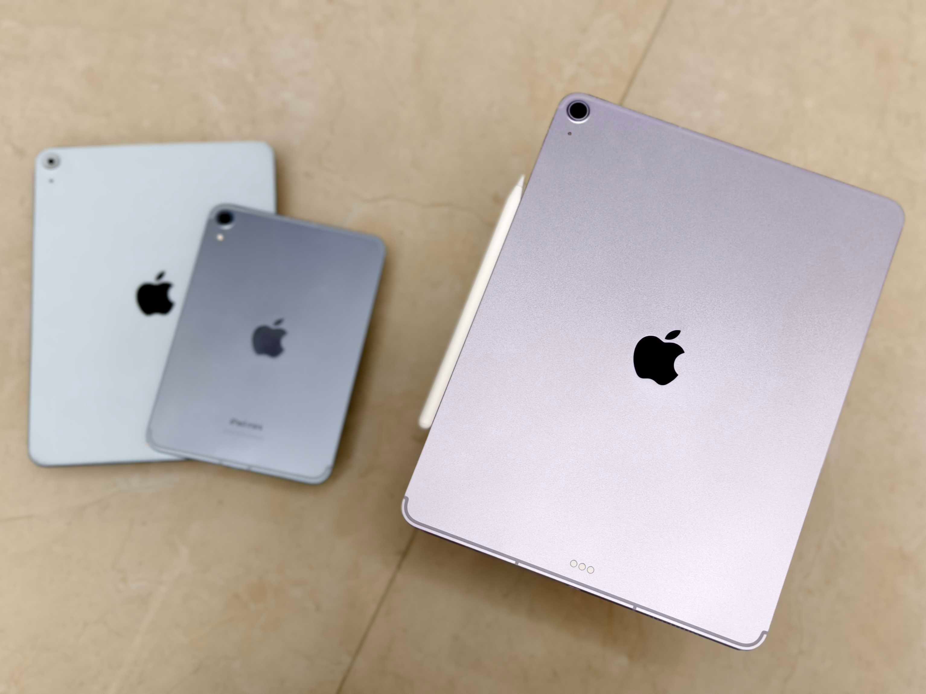 13-inch iPad Air (2025) with iPad Air 4 and iPad Mini 7 in the background.