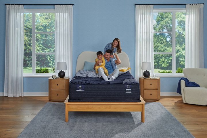 Father on bed with two kids