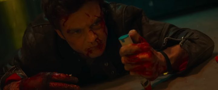 Jack Quaid holding an adrenaline shot in Novocaine