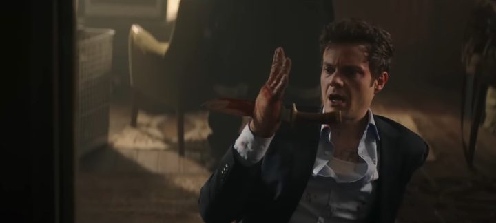 Jack Quaid with a knife through his hand in "Novocaine."