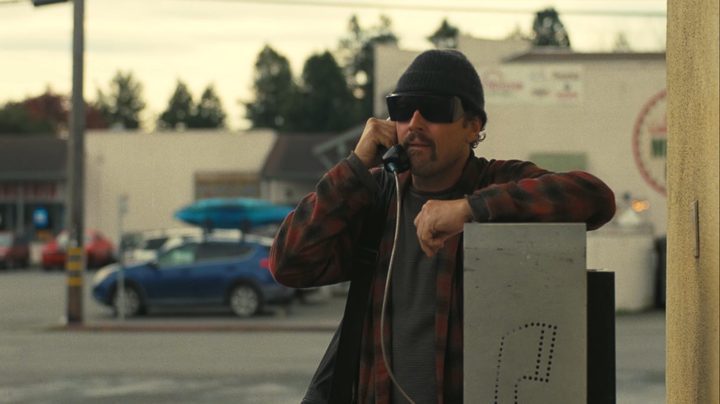 Leonardo DiCaprio holds a phone to his ear.