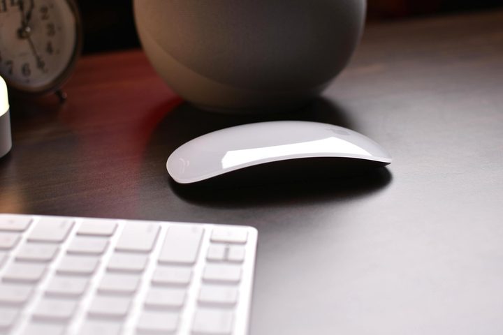A Magic Mouse and a Magic Keyboard on a desk.