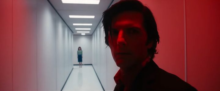 Mark with Helly looking at him from across a hallway in "Severance" season 2.