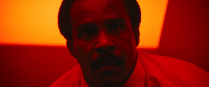 Mr. Milchick in a red room in "Severance" season 2, episode 10.
