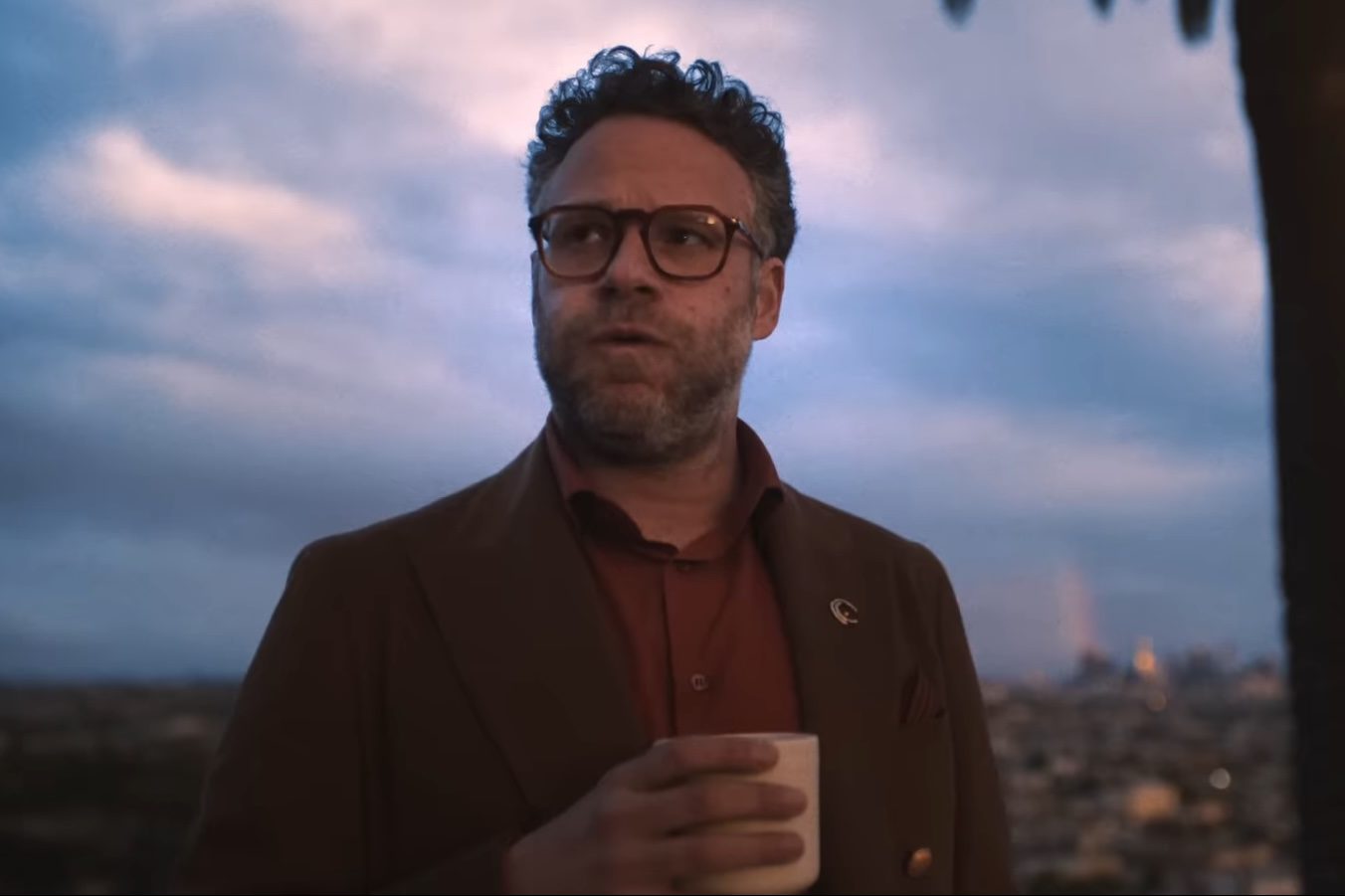 Seth Rogen holding a mug in The Studio.