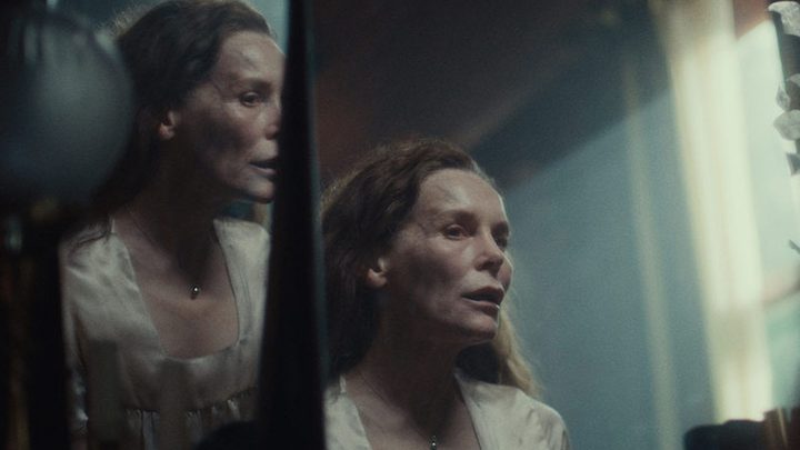 Alice Krige stares at her reflection in She Will.