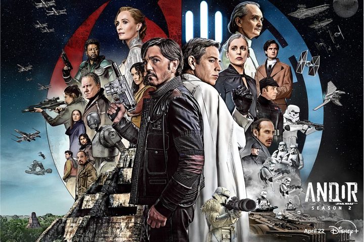 Diego Luna and Star Wars characters pose.