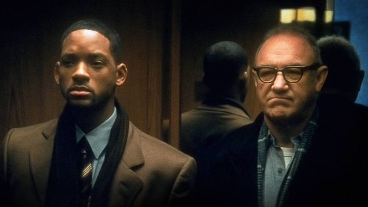 Will Smith and Gene Hackman side by side in an elevator, both looking angry in Enemy of the State.