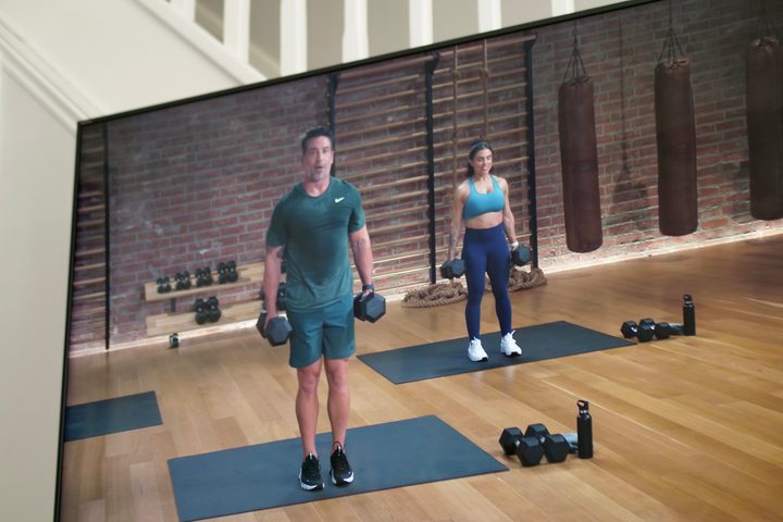 An Apple Fitness+ workout screen on a TV.