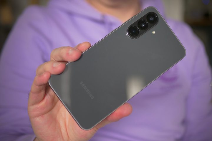 A person holding the Samsung Galaxy A56.