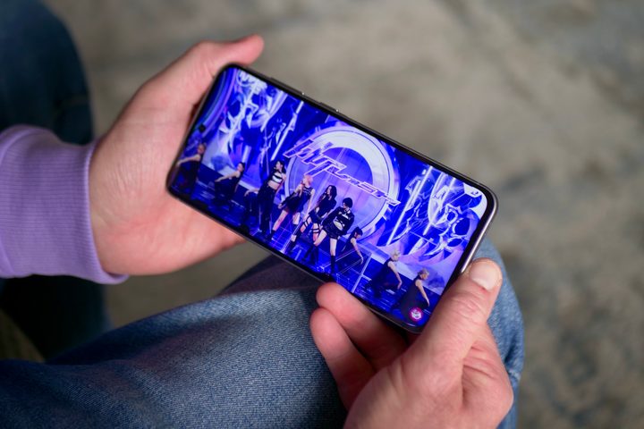 A person watching a video on the Samsung Galaxy A56.