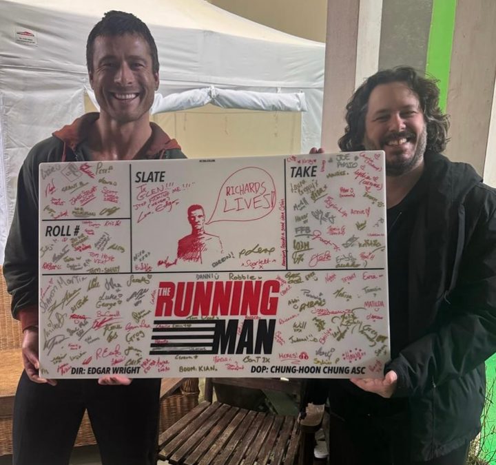 Glen Powell and Edgar Wright pose for a photo.