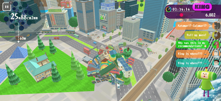 A giant ball rolls through a city in Katamari Damacy Rolling Live.
