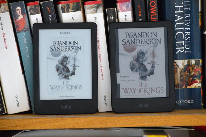 The Kobo Clara BW next to the Kobo Clara Colour on a bookshelf.