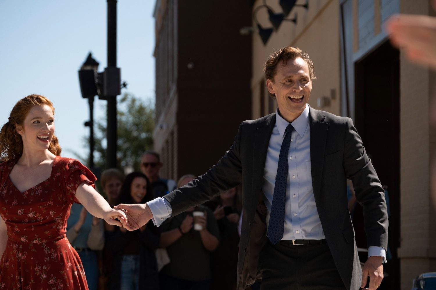 Tom Hiddleston holds Annalise Basso's hand in "The Life of Chuck."