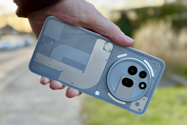 A person holding the Nothing Phone 3a Pro.